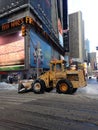 Snow Removal Tractor on Times Square in Snow in Winter. Royalty Free Stock Photo