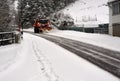 Snow removal vehicle clears the entrance to the village of Altenau in the Harz Mountains of snow
