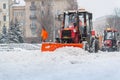 Snow removal vehicle removing snow. Tractor clears the way after heavy snowfall winter: Kiev, Ukraine-February 08, 2021