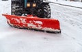 Snow removal vehicle removing snow. Tractor clears the way after heavy snowfall winter Royalty Free Stock Photo