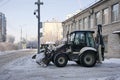 Snow removal vehicle removing snow. Tractor clears the way after heavy snowfall winter. High quality photo Royalty Free Stock Photo