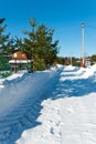 Snow-removed road in countryside