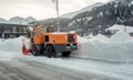 Snow remover truck cleaning snow covered streets during winter Royalty Free Stock Photo