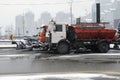 Snow removing equipement on the street in blizzard.