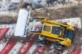 Snow-removing machine cleaning the road marking Royalty Free Stock Photo