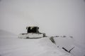 Snow removing machine on mountain slope