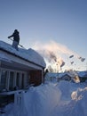 Snow removing from the roof