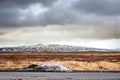 Snow by a road in dramatic scenery