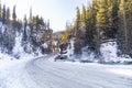 Snow road in the mountains near river in Altai mountains. Red gate Royalty Free Stock Photo