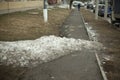 Snow on the road. A pile of snow lies on the asphalt Royalty Free Stock Photo