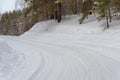 Ice and snowstorm on a country road. Clearing the road from snowdrifts