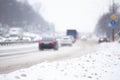 Snow roads in the city. Blizzard traffic, low visibility. City storm. Kiev, Ukraine. Royalty Free Stock Photo