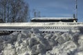 Snow on roof. Snow removal from roof of house. Large clumps of ice Royalty Free Stock Photo