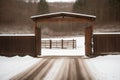 Snow on a rusty farm gate