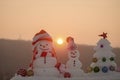 Snow sculptures on sunset sky background Royalty Free Stock Photo