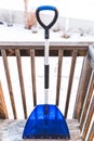Snow shovel on back porch Royalty Free Stock Photo