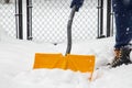 Person Shoveling Snow off Walk Way