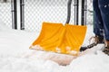 Person Shoveling Snow off Walk Way