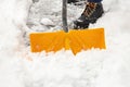 Person Shoveling Snow off Walk Way