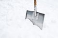 Snow shovel in a snowdrift. Copy space. Royalty Free Stock Photo