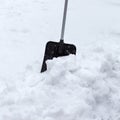 Snow shovel in a snowdrift. Winter time Royalty Free Stock Photo