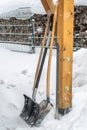 Snow shovel standing in the snow