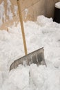 Snow shovel stuck in the snow after a storm