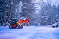 snow shovel tractor on a heavy snowy day at Heike No Sato Village in Tochigi Prefecture, Nikko City, JAPAN. soft focus