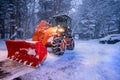 snow shovel tractor on a heavy snowy day at Heike No Sato Village in Tochigi Prefecture, Nikko City, JAPAN. soft focus