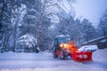 snow shovel tractor on a heavy snowy day at Heike No Sato Village in Tochigi Prefecture, Nikko City, JAPAN. soft focus