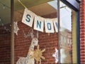 Snow sign in a shop window