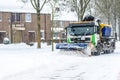 Snow slide through the streets of dronten and spread it so that the snow will disappear quickly Royalty Free Stock Photo