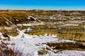 Snow starts to melt in Horseshoe Canyon, Drumheller, Alberta, Canada