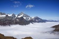 snow stone mountains with sea of mist and clear blue sky in Switzerland