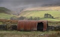 A snow storm approaches an old tin shed near Garrigill,, Cumbria