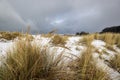 Snow and storm clouds at the Oregon coast Royalty Free Stock Photo