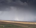 A snow storm approaches a farm near Garrigill,, Cumbria