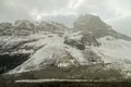 A snow storm enveloping rugged snowy mountains