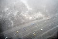 Snow storm over the road with cars. Blizzard over the highway, top view Royalty Free Stock Photo