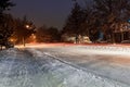 Snow on street and Highway during December 2016, icy road winter storm, in urban area at night Royalty Free Stock Photo