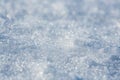 Snow surface close-up. Winter background with snow texture and beautiful bokeh. Royalty Free Stock Photo