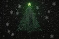 A snow-surrounded, illuminated Christmas tree made from electronic components, creating a festive and modern scene. Royalty Free Stock Photo