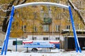 Snow on the swings. Winter background, selective focus