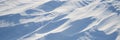 Snow texture. Wind sculpted patterns on snow surface Royalty Free Stock Photo