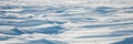 Snow texture. Wind sculpted patterns on snow surface Royalty Free Stock Photo