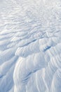 Snow texture. Wind sculpted patterns on snow surface. Royalty Free Stock Photo