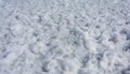 Snow textured coating of the bay surface, white texture background Royalty Free Stock Photo