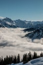 Snow on the top of the mountains and fog down the valley Royalty Free Stock Photo