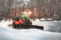 Snow Tractor Clearing Snow off Ice Rink Royalty Free Stock Photo