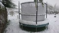 Snow on a trampoline in the back garden